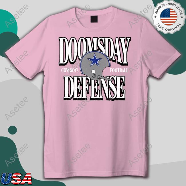 Cowboys DC Dan Quinn wearing a Doomsday Defense shirt today